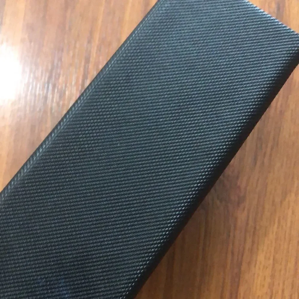 Nicole Miller Black hard triangular eyeglass case.